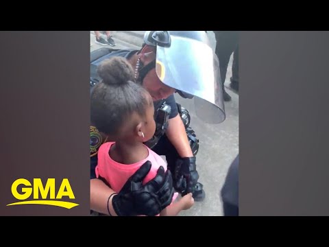 Police officer comforts little girl after she asks: &#039;Are you going to shoot us?&#039; l GMA Digital